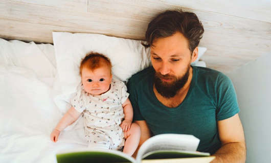 father-reading-book-to-baby-daughter.jpg